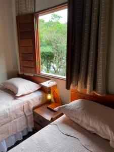 Reserva do Bosque Hospedaria e Natureza客房内的一张或多张床位