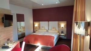 Postel nebo postele na pokoji v ubytování Hotel Koch