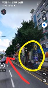 a yellow circle on a city street with a red arrow at Sun Stay in Busan
