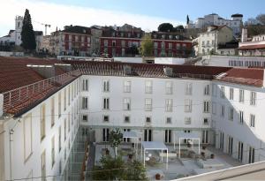 
a building that has a lot of windows on it at Hotel Convento do Salvador in Lisbon
