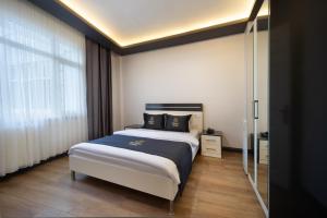 Postel nebo postele na pokoji v ubytování Bakırköy Zeugma Suit Otel