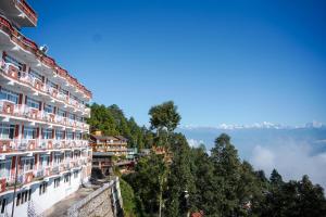 a view of the mountains from the balcony of a building at Mountain Vista Retreat - Nagarkot in Nagarkot