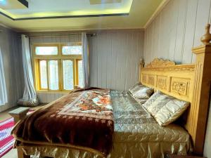 a bedroom with a large bed in a room at Alpine Resort Khaplu in Khaplu