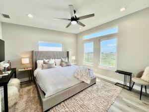 a bedroom with a bed and a ceiling fan at Modern Sanctuary in Saint Augustine in St. Augustine
