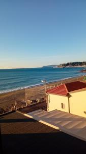 a view of the beach from the balcony of a house at Casa al mare Pietro in Varazze