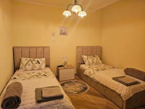 Postel nebo postele na pokoji v ubytování Bob Marley Bnb & Hostel