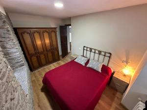 A bed or beds in a room at La Casa del Maestro