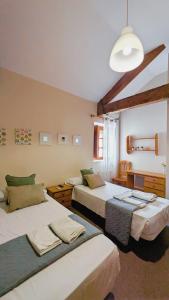 Postel nebo postele na pokoji v ubytování Hostal El Convent de Moncada