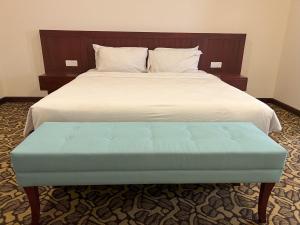 a bed with a blue bench in a bedroom at JOM at deRiviera Self check-in in Melaka +27 photos