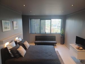 a living room with a bed and a couch at B & B Fish World in Vlissingen