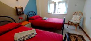 A bed or beds in a room at Appartamento Tre Angeli a pochi passi dal mare