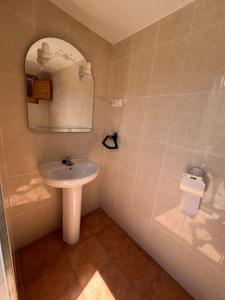 a bathroom with a sink and a mirror at Cabaña El Paraíso in Manzanera +22 photos