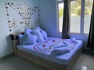 Postel nebo postele na pokoji v ubytování Island Concept Maldives