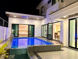 a swimming pool in the middle of a house at Swimming Pool Homestay in Kuah