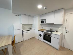 Η κουζίνα ή μικρή κουζίνα στο P3 Rivas Futura Apartment