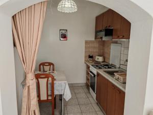 Kuchyň nebo kuchyňský kout v ubytování Apartment Rosetta