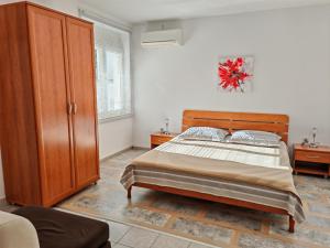 Postel nebo postele na pokoji v ubytování Apartment Rosetta