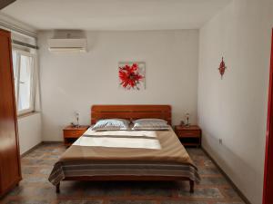 Postel nebo postele na pokoji v ubytování Apartment Rosetta