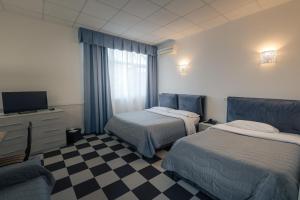Кровать или кровати в номере Hotel Giulietta e Romeo