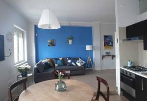 a living room with a couch and a table at Belvedere Quartieri Napoli in Naples