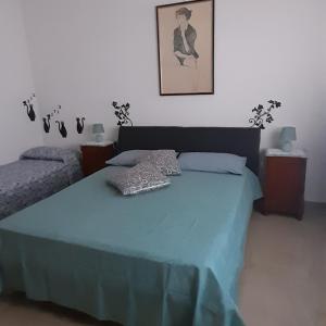 Letto o letti in una camera di La comodità a due passi dal mare di Mondello