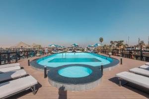 a swimming pool on the deck of a resort at Five Stars Nile Cruise from Luxor to Aswan 4 nights included sightseeing in Aswan