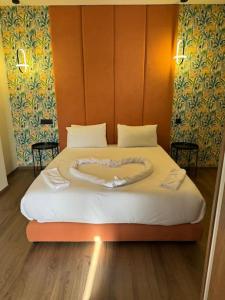 Ένα ή περισσότερα κρεβάτια σε δωμάτιο στο 47 Appartement luxueux proche de la mer