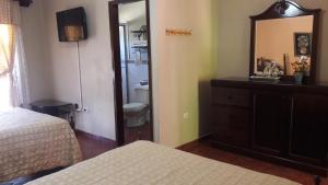 Łóżko lub łóżka w pokoju w obiekcie Hotel Acropolis Maya
