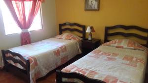 Postel nebo postele na pokoji v ubytování Hotel Brisas de Copan