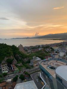 an aerial view of a city with the ocean at The Bay Apartment Lampung Ocean View in Kuala