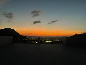 a sunset from the rooftop of a building at Studio Yasmine in Azrou +2 photos