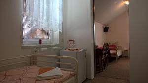 Postel nebo postele na pokoji v ubytování Penzion V Hájku