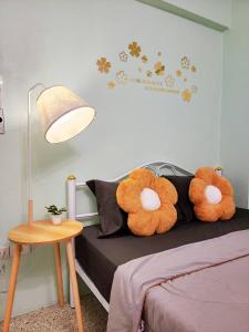 a bedroom with a bed with two stuffed animals on it at 811-STP Homely room Free Wi-Fi and Near BTS Line in Bangkok