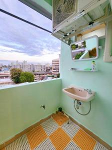 a bathroom with a sink and a window at 811-STP Homely room Free Wi-Fi and Near BTS Line in Bangkok