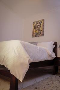 Postel nebo postele na pokoji v ubytování Summit Side Nanyuki - A One Bedroom Apartment