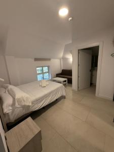 Postel nebo postele na pokoji v ubytování Hostel Villa Miguela