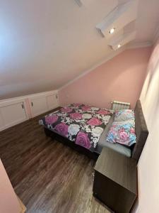 a small bedroom with a bed in a room at Adel's in Subotica