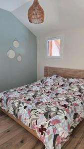 Postel nebo postele na pokoji v ubytování Appartement moderne et cosy + 2 fotografie
