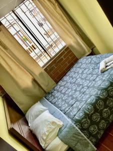 Una cama o camas en una habitación de Edificio catedral 33 fotos más