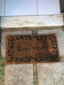a sign that says le pen virtual on a sidewalk at Praia de Geribá C 1 in Búzios +2 photos