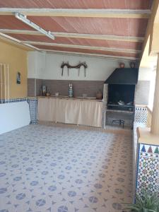 a large room with a table and a fireplace at turismo rural la solana in Murcia