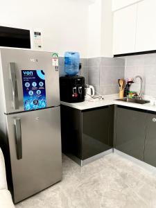 Η κουζίνα ή μικρή κουζίνα στο City Oasis, 1 Bedroom