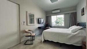 Katil atau katil-katil dalam bilik di Flat em Hotel com piscina, garagem, Wi-fi e Limpeza diária