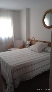 Postel nebo postele na pokoji v ubytování Acogedor y Amplio Apartamento familiar a pie de playa