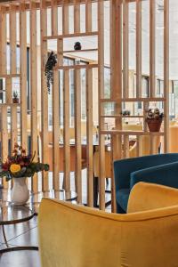 a dining room with chairs and a table at Hôtel Restaurant AKENA Molinges - La Brocatelle in Saint-Claude +48 photos