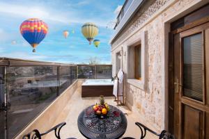 A balcony or terrace at Cappadocia Pegasos Cave Suite Hotel
