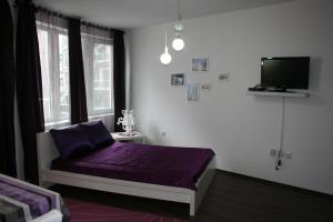 Cama o camas de una habitación en Purple Orange Studios