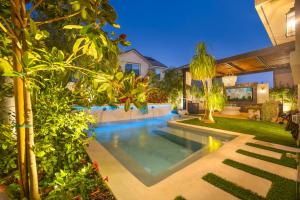 a swimming pool in the backyard of a house at # Marbella Lane - Stylish Dream Home in RMV with Pool in Mission Viejo