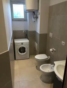 a small bathroom with a toilet and a sink at La Rosa dei Venti in Foligno +15 photos