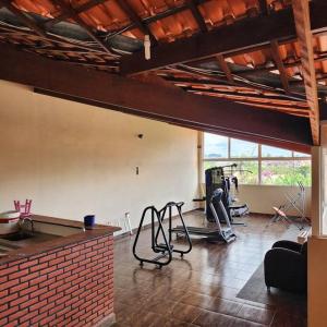 an empty room with a gym with a brick wall at Rancho da Diversão com 4 quartos in Sao Paulo